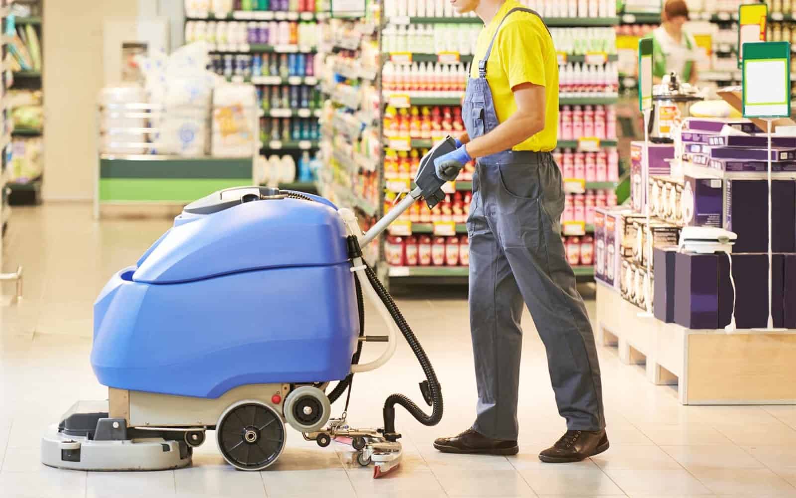 A man cleaning the floor in a store