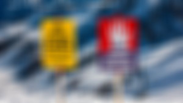 Zwei Warnschilder auf einem schneebedeckten Berg: Das eine weist auf das „Ende des kontrollierten Skigebiets“ hin, das andere warnt vor Lawinengefahr.