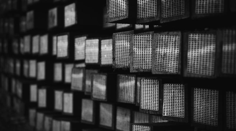black-and-white photo of a warehouse full of boxes with grids