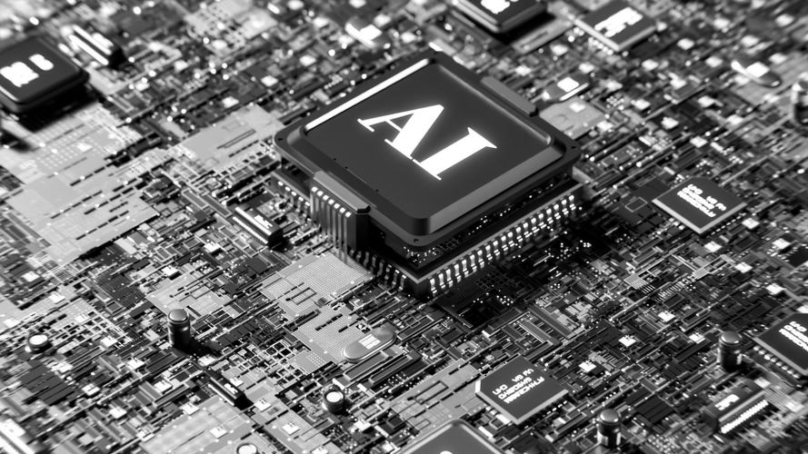 Primer plano de una placa de circuito con un chip prominente etiquetado "AI" en el centro, rodeado de varios componentes electrónicos.