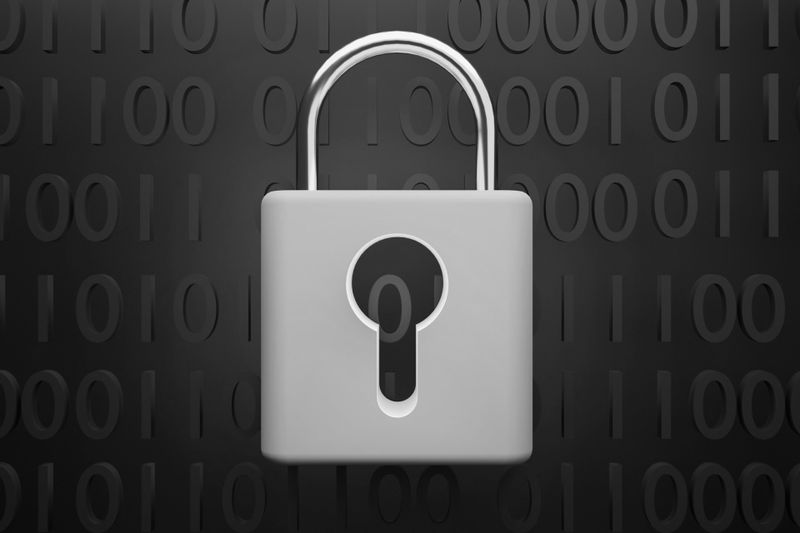 A silver padlock on a dark background with binary code, symbolizing digital security and encryption.
