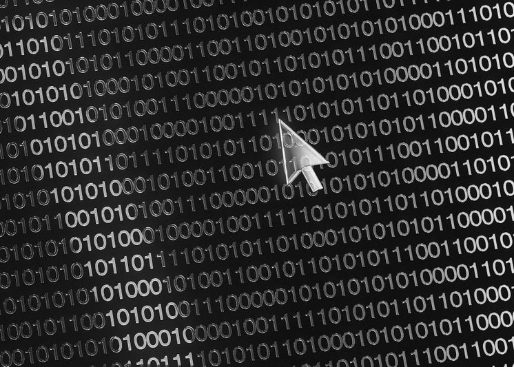 Un curseur numérique plane sur un arrière-plan de code binaire composé de uns et de zéros, symbolisant la technologie et l'informatique.