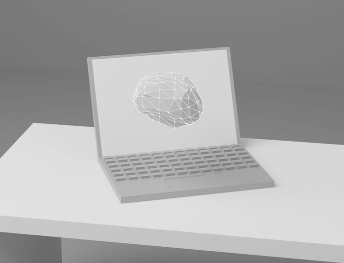 Un ordenador portátil sobre un escritorio blanco con un modelo 3D del cerebro en forma de estructura alámbrica en la pantalla, sobre un fondo gris neutro.