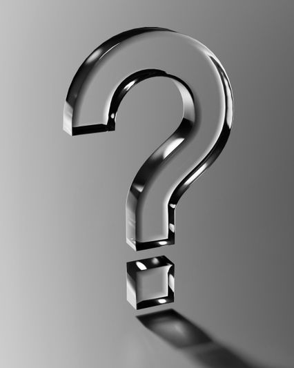 Reflective glassy question mark floating against a smooth gray background, casting a soft shadow.