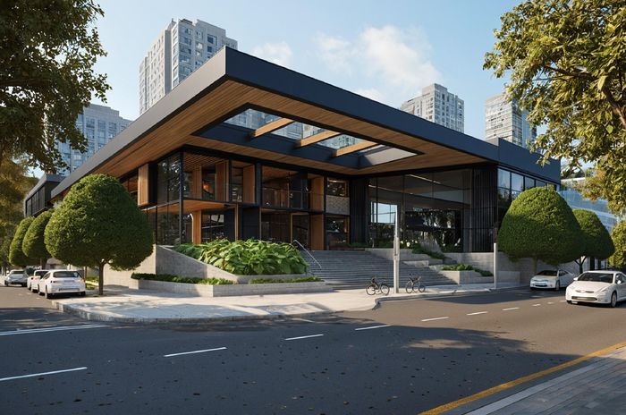 Modern building with large windows and a wooden facade, surrounded by trees and parked cars on a sunny day. Skyscrapers visible in the background.