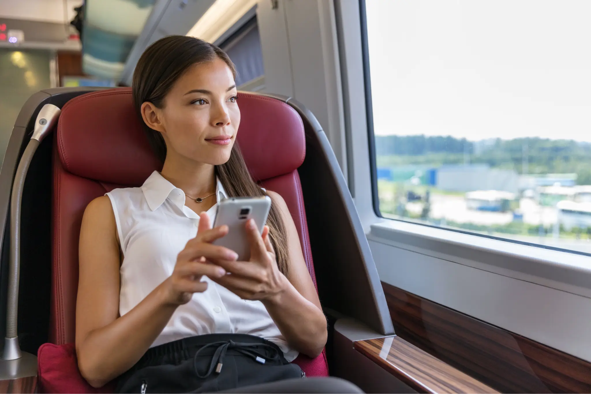 A person using mobile data on a train