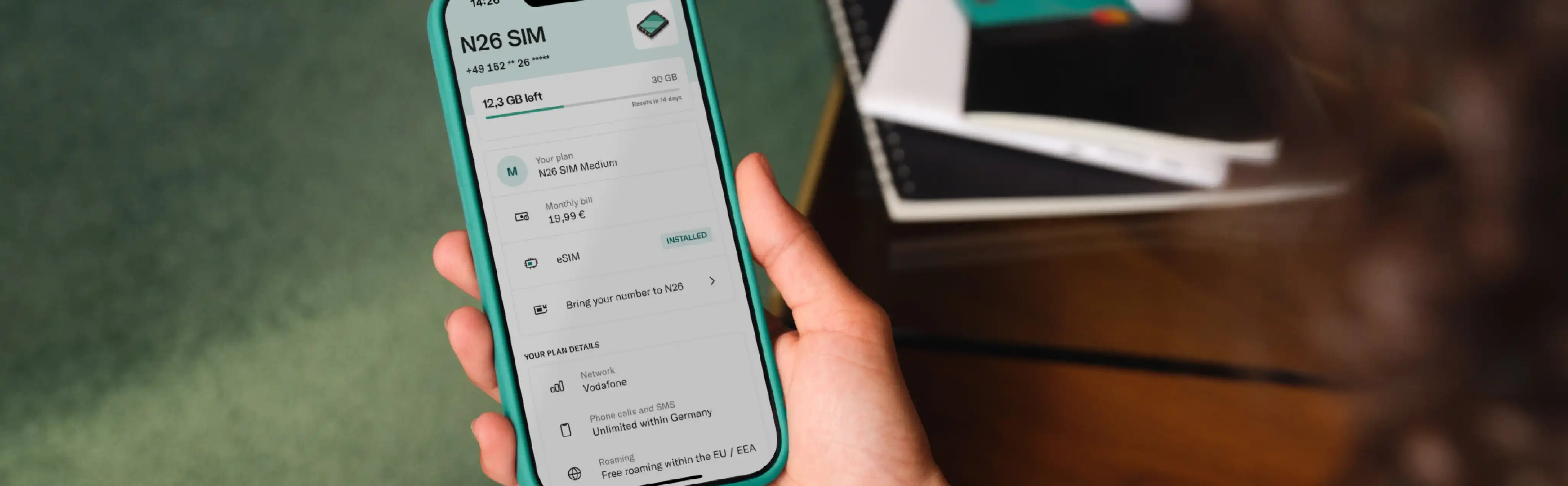A person purchasing an eSIM via the N26 banking app, an example of embedded telco in practice