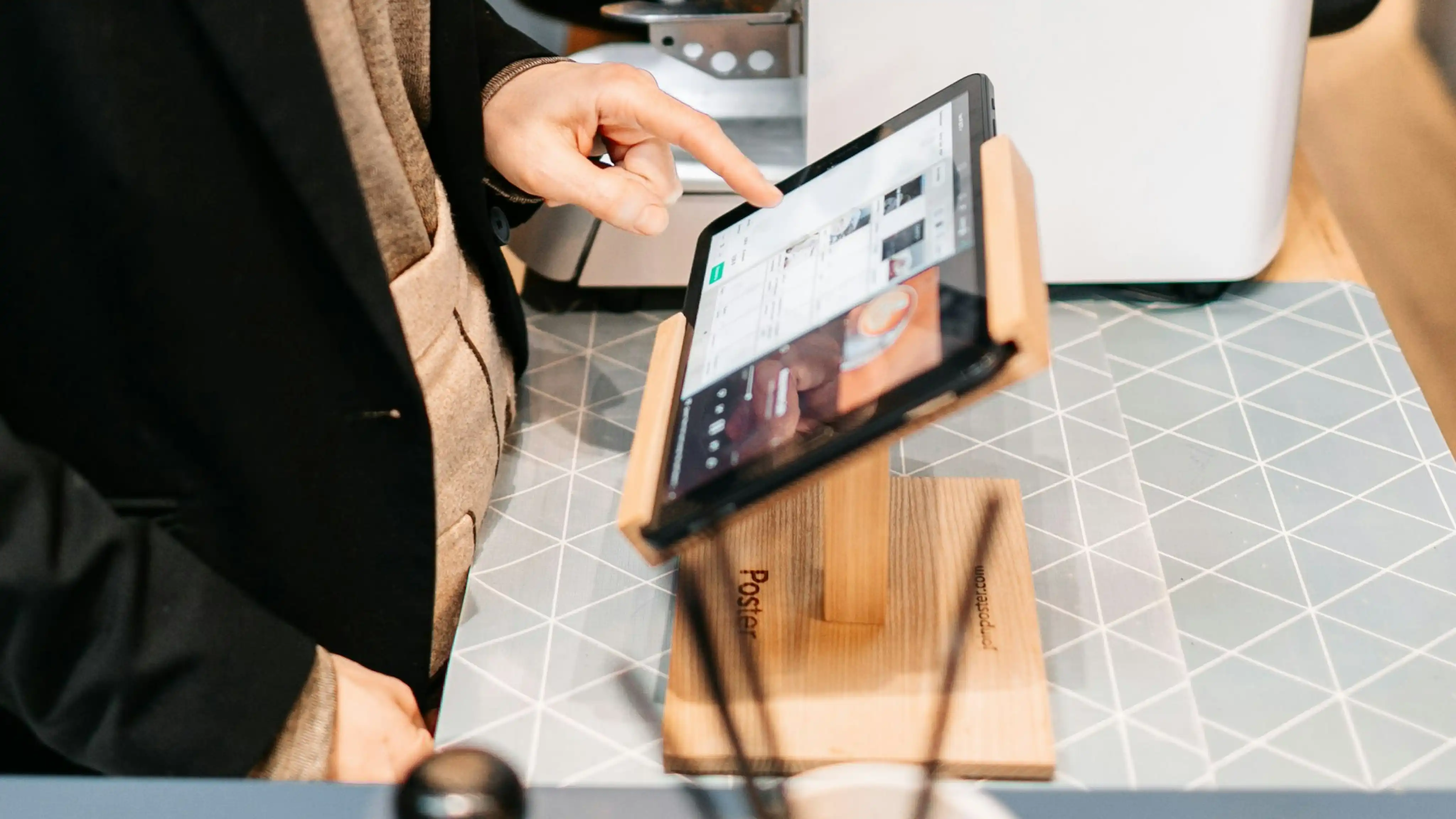 A person using an iOS-based point of sale terminal