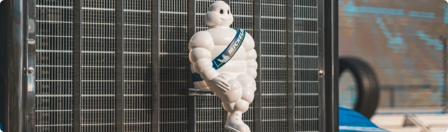 Successful Mobile Services - The Michelin Man in front of a truck's grill
