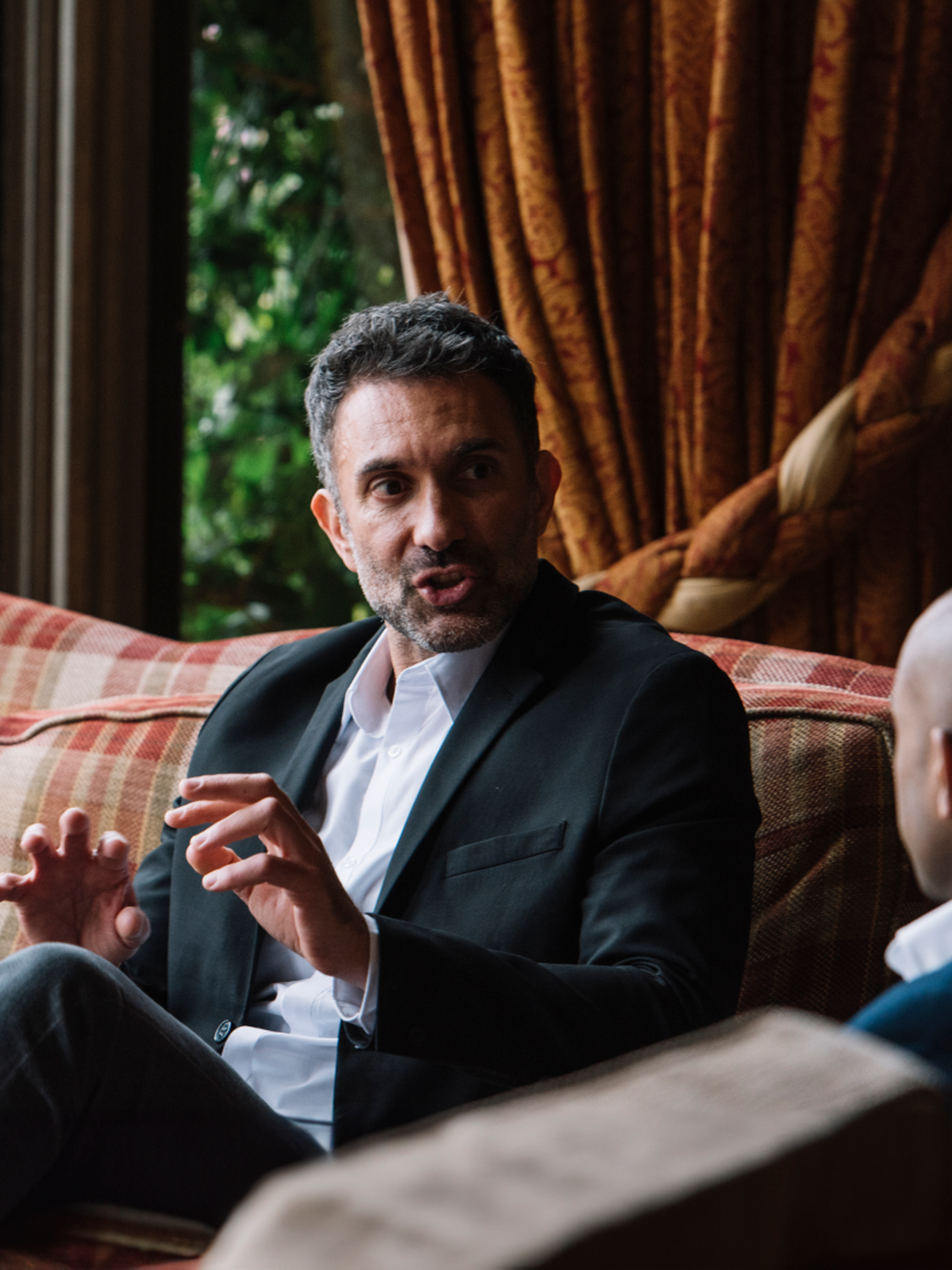 Man explaining something to another person