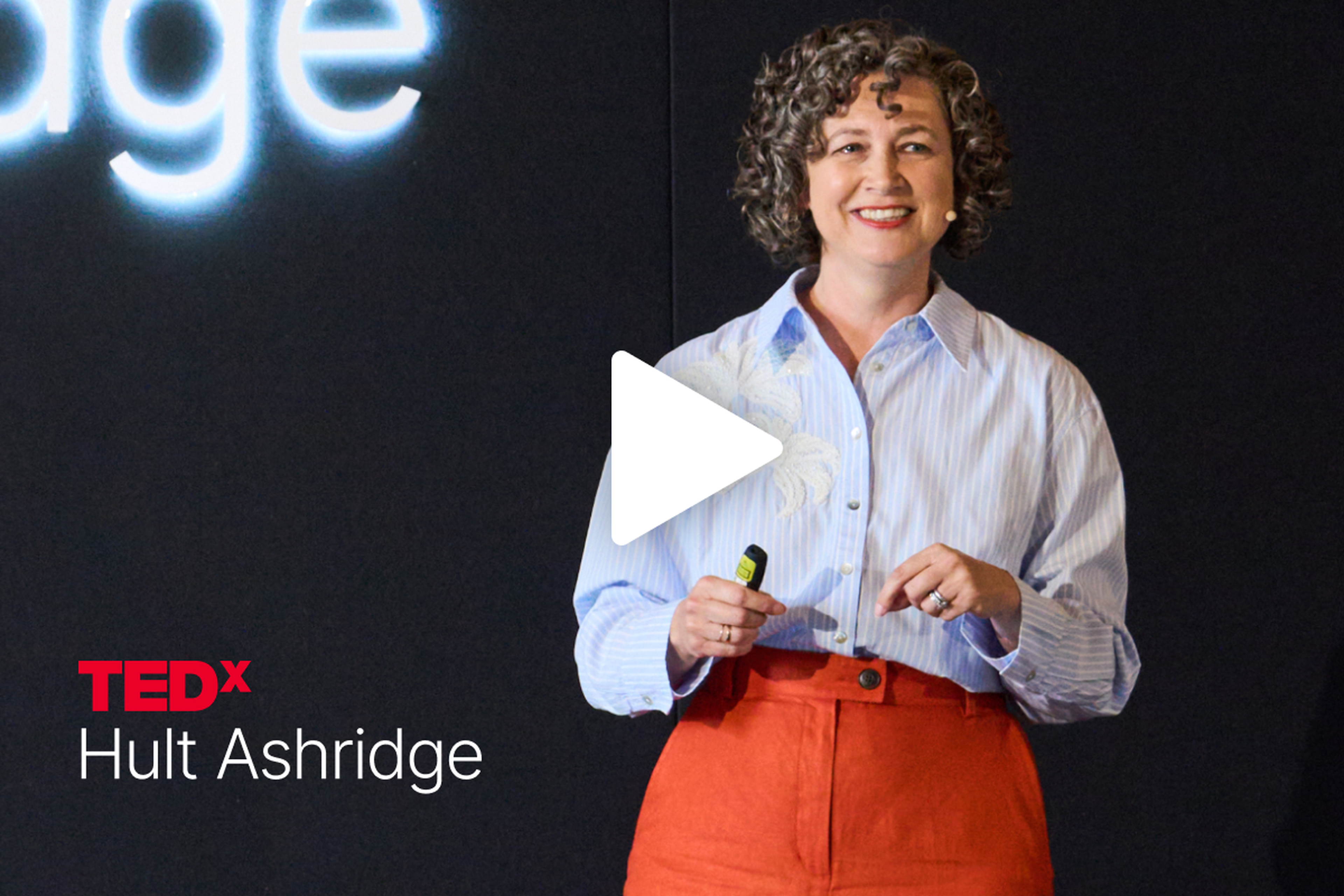 Debbie Wayth speaks on stage at TEDx Hult Ashridge