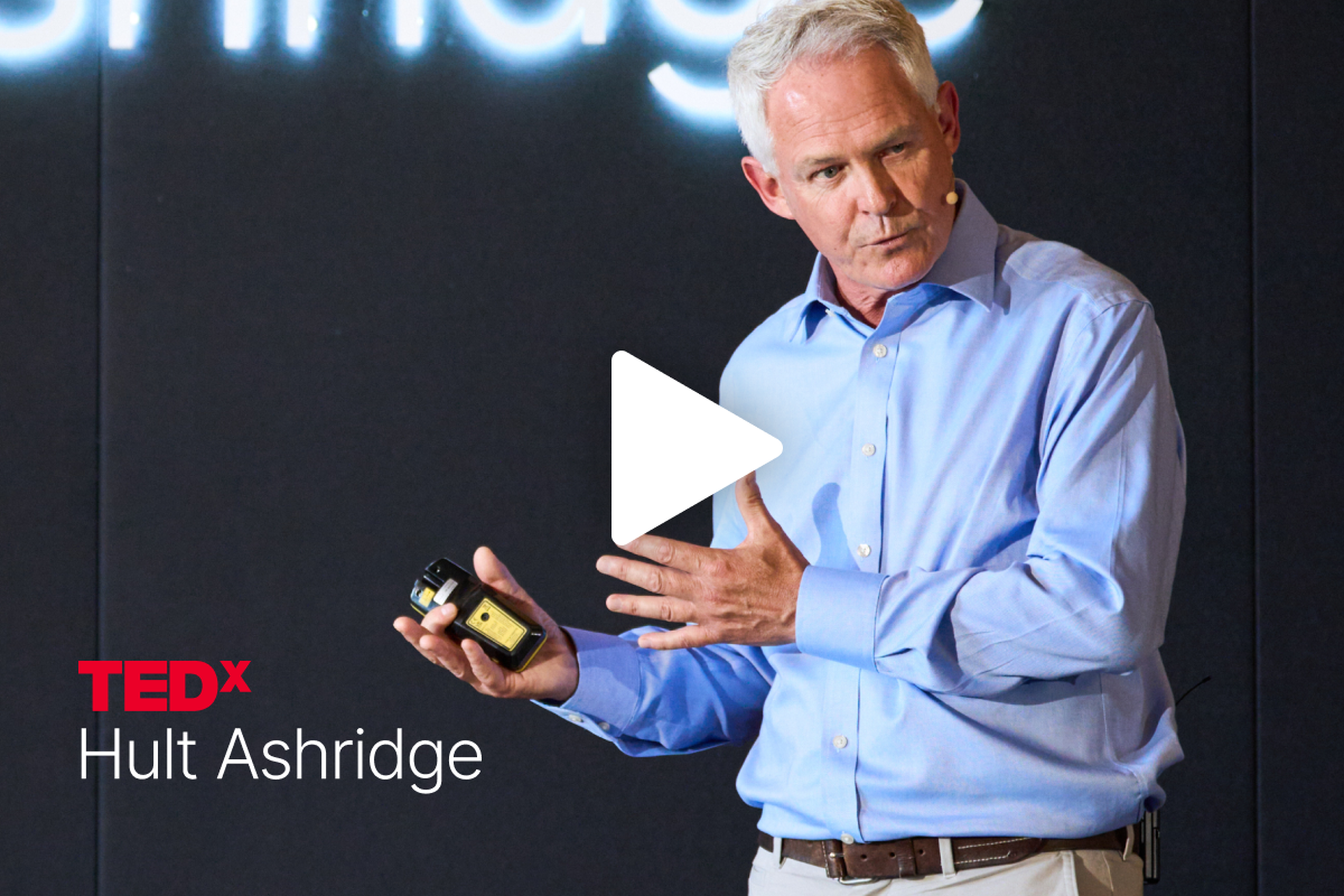 David Briggs speaks on stage at TEDx Hult Ashridge