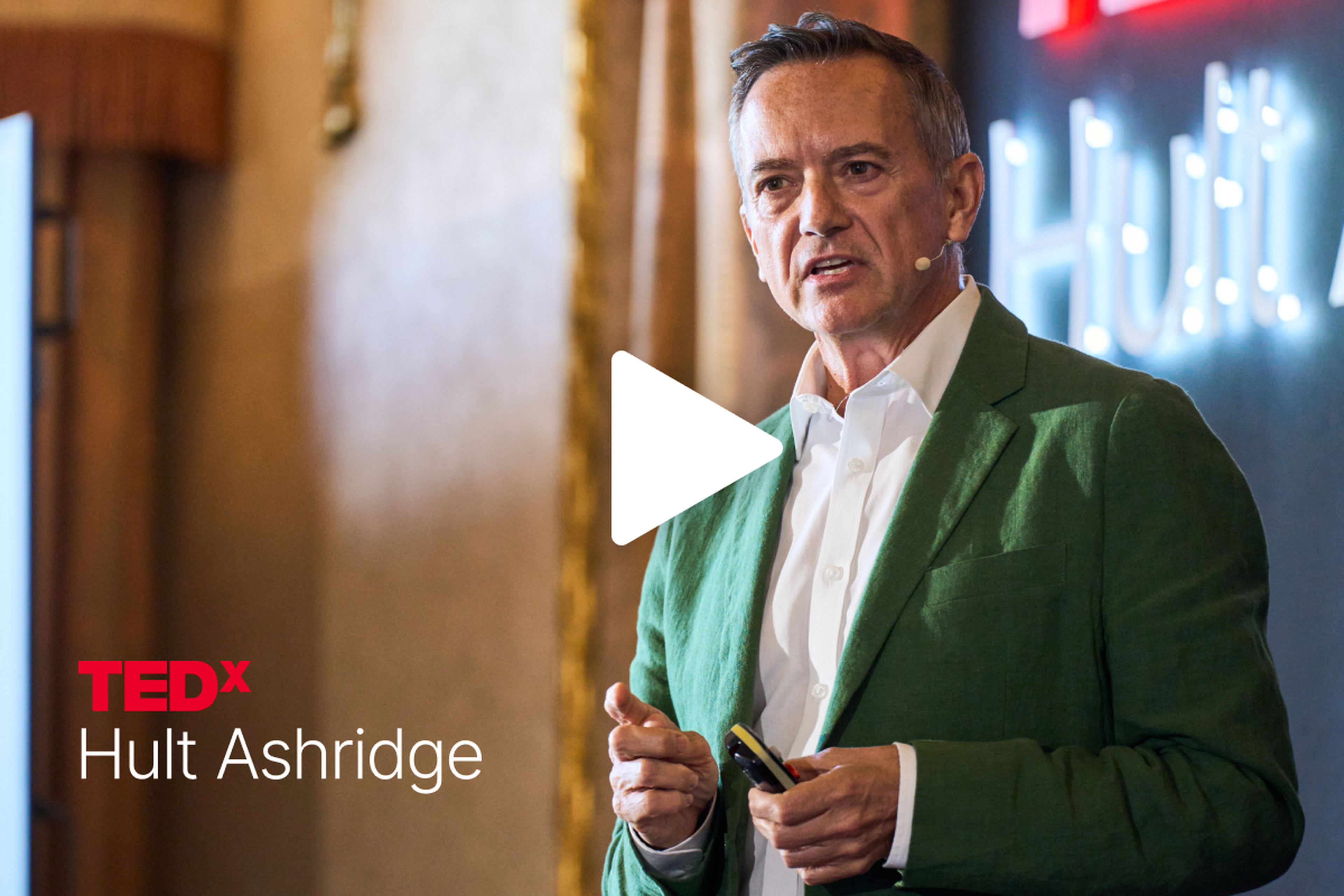 Chris Samsa speaks on stage at TEDx Hult Ashridge