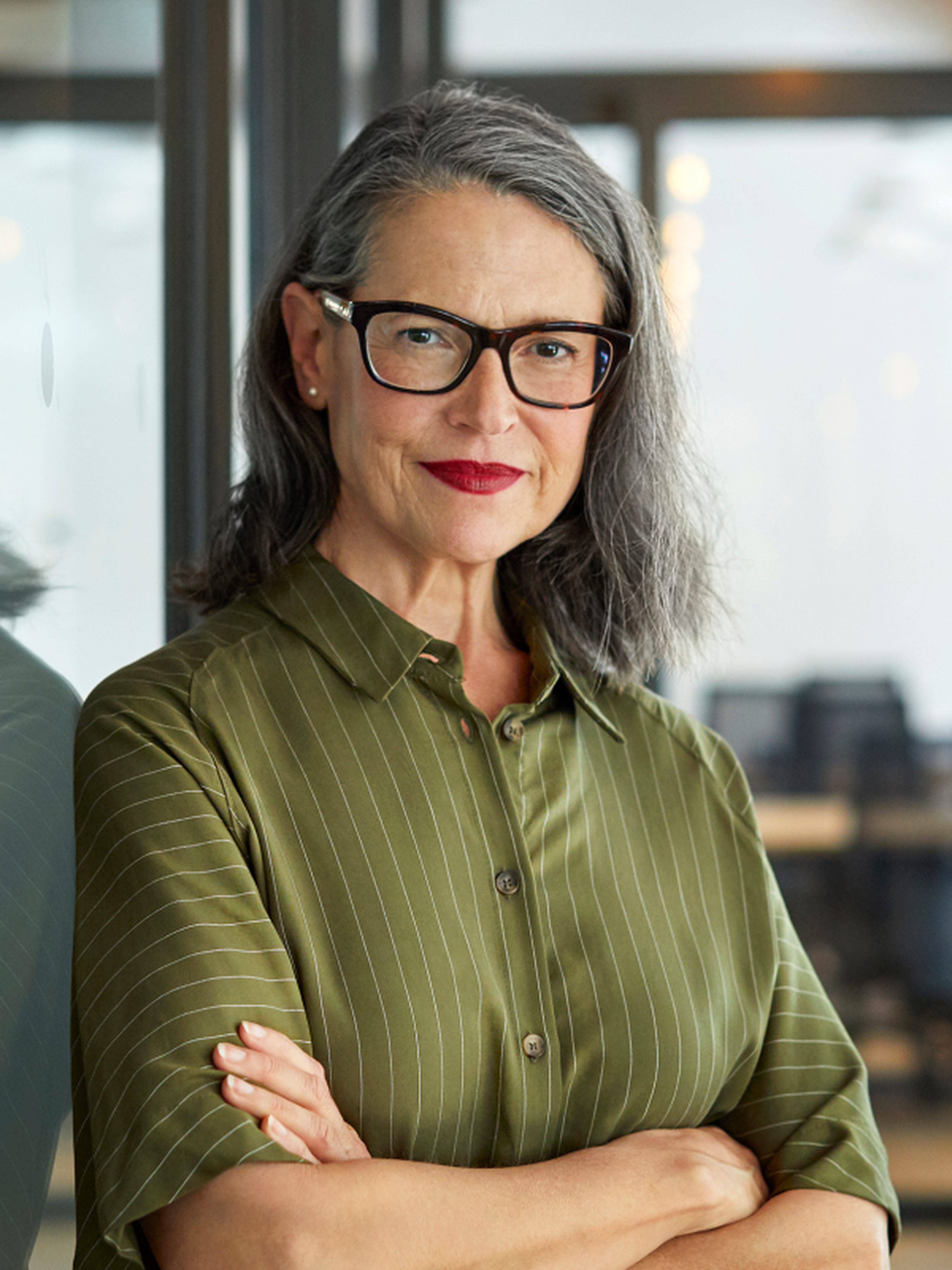 Professional leader with her arms folded
