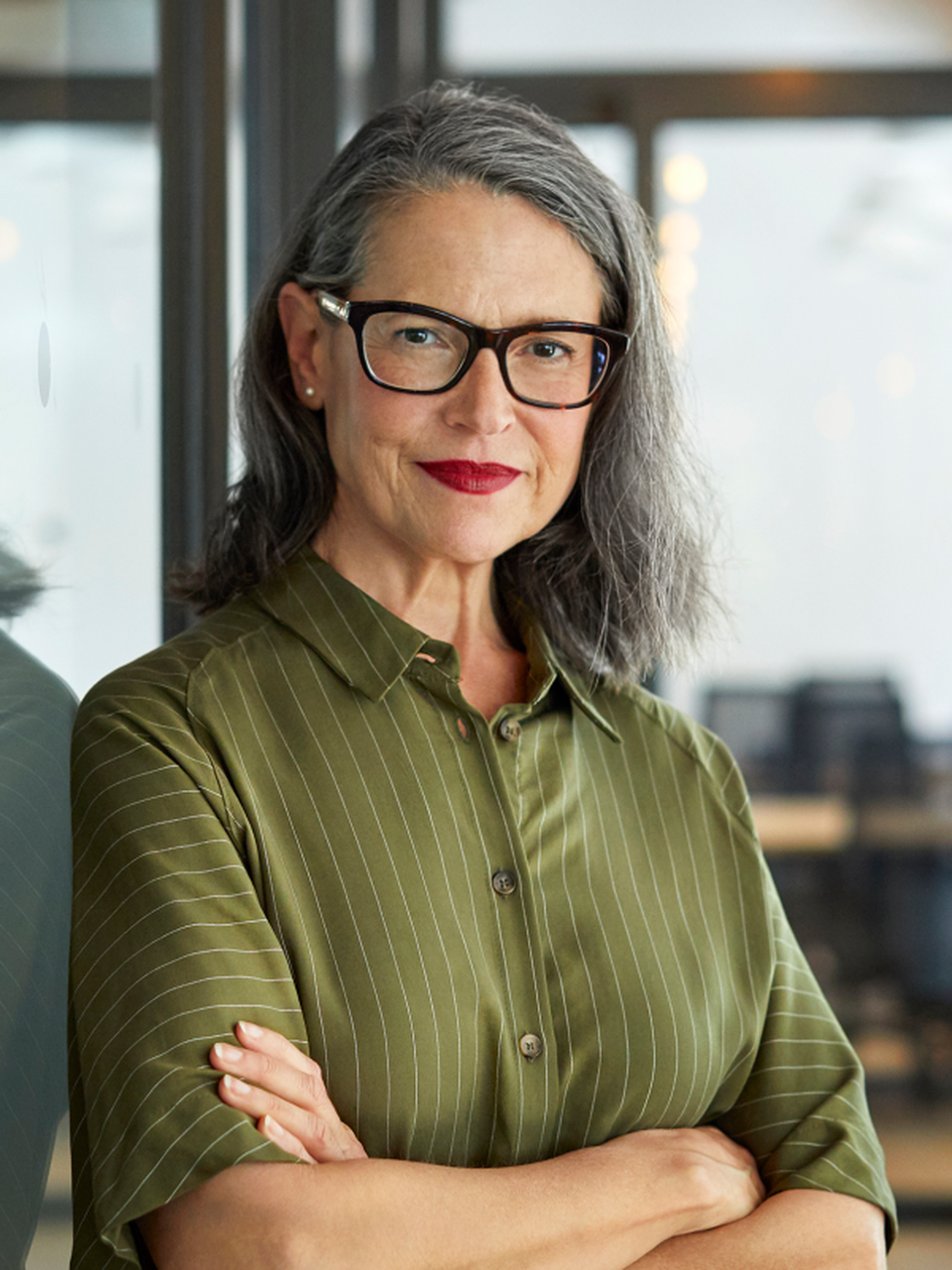 Professional leader with her arms folded