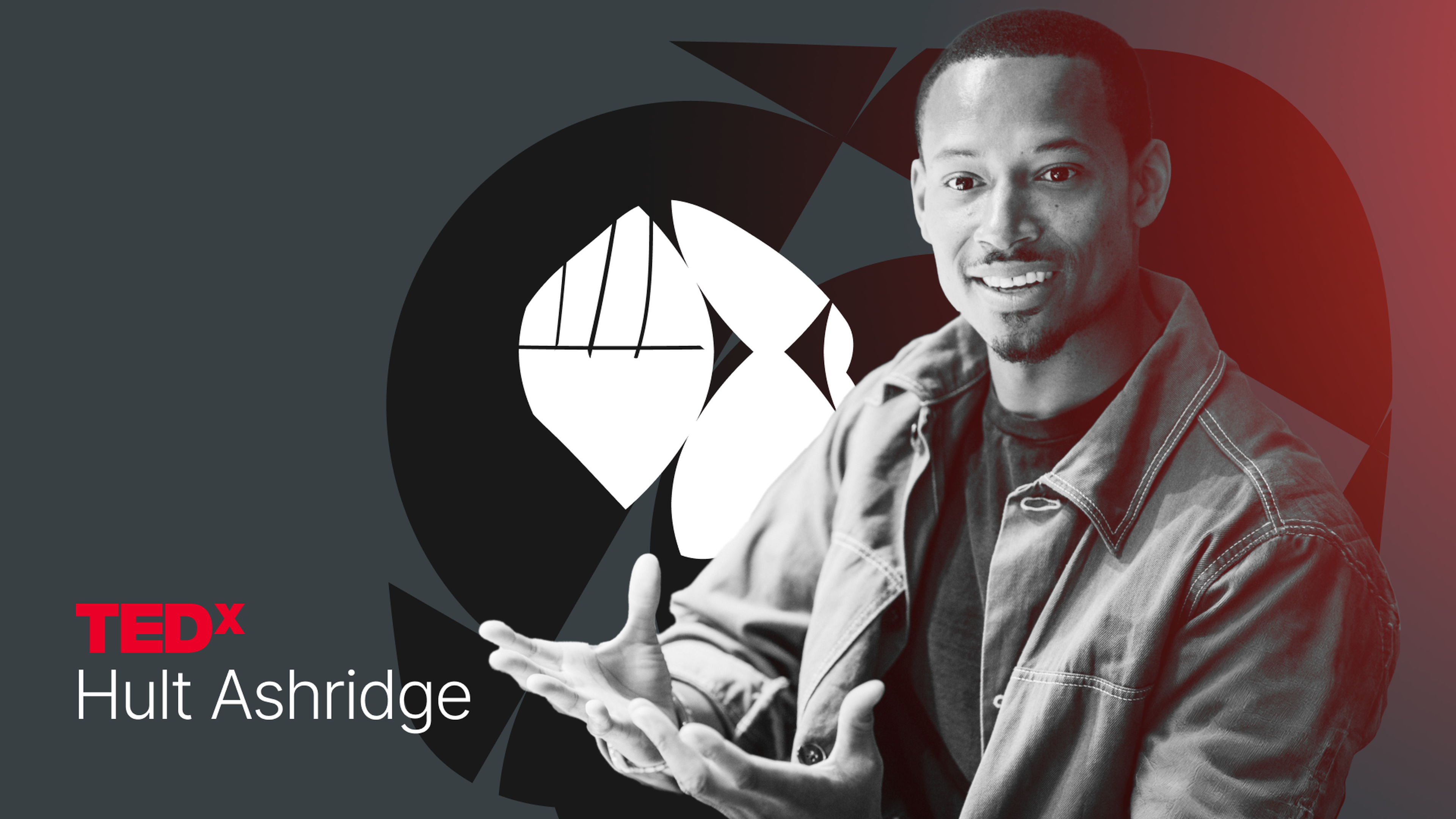 Man smiling and gesturing, wearing a jacket, with TEDx Hult Ashridge logo in the background.