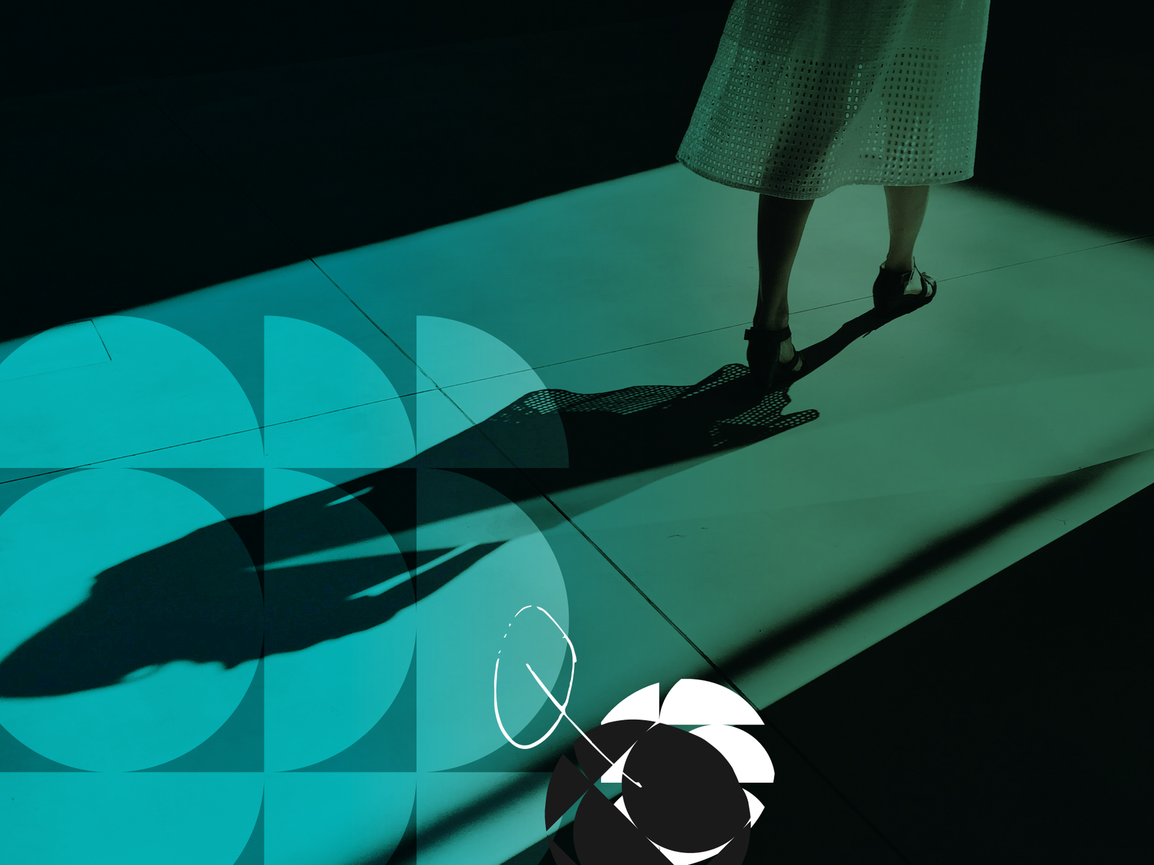 A person wearing a perforated skirt casts a shadow on a teal-tinted floor with geometric patterns and a flower-like design.