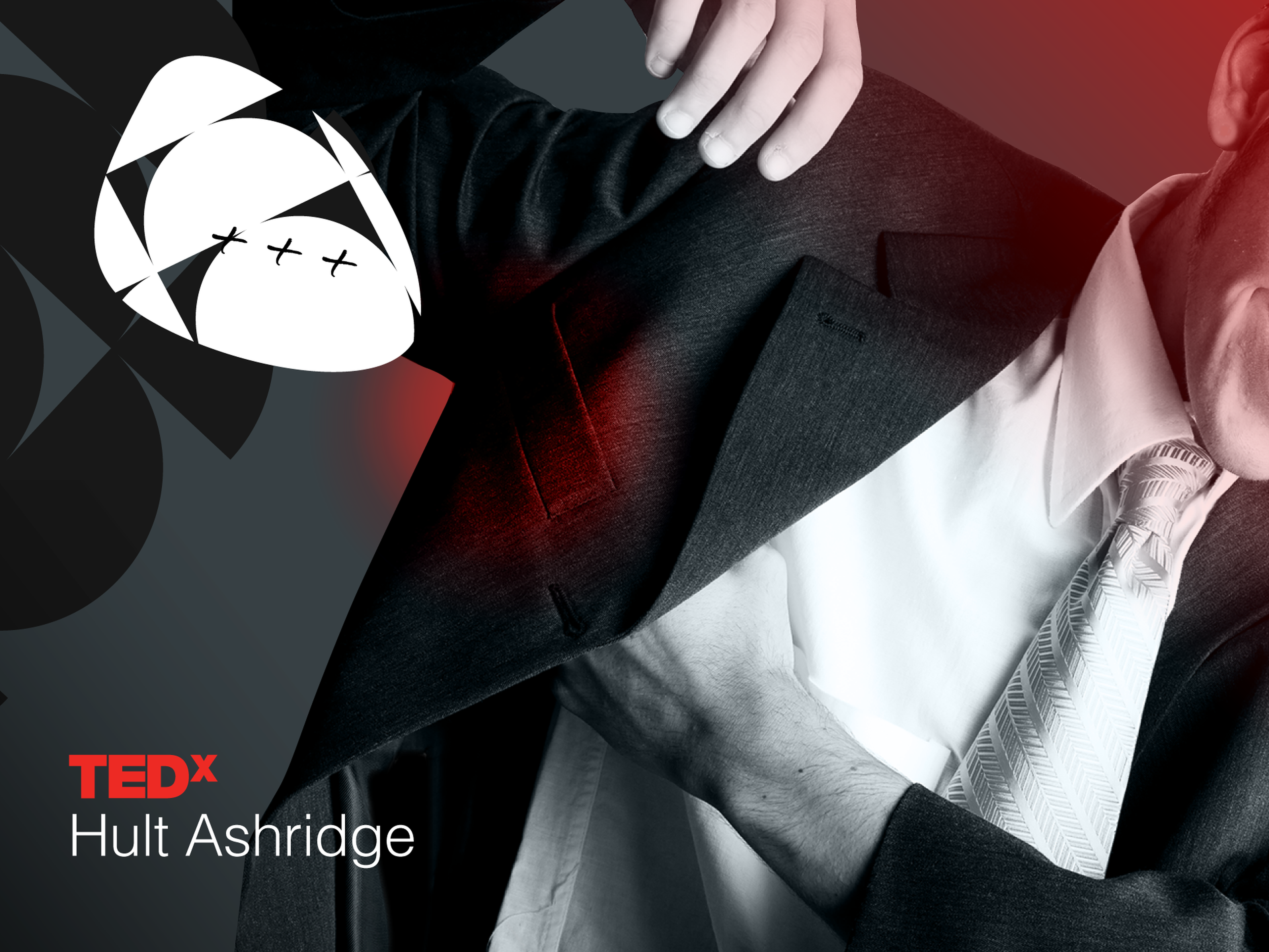 Man adjusting suit jacket, with hand inside, wearing a white shirt and patterned tie. TEDx Hult Ashridge logo is in the lower left corner.
