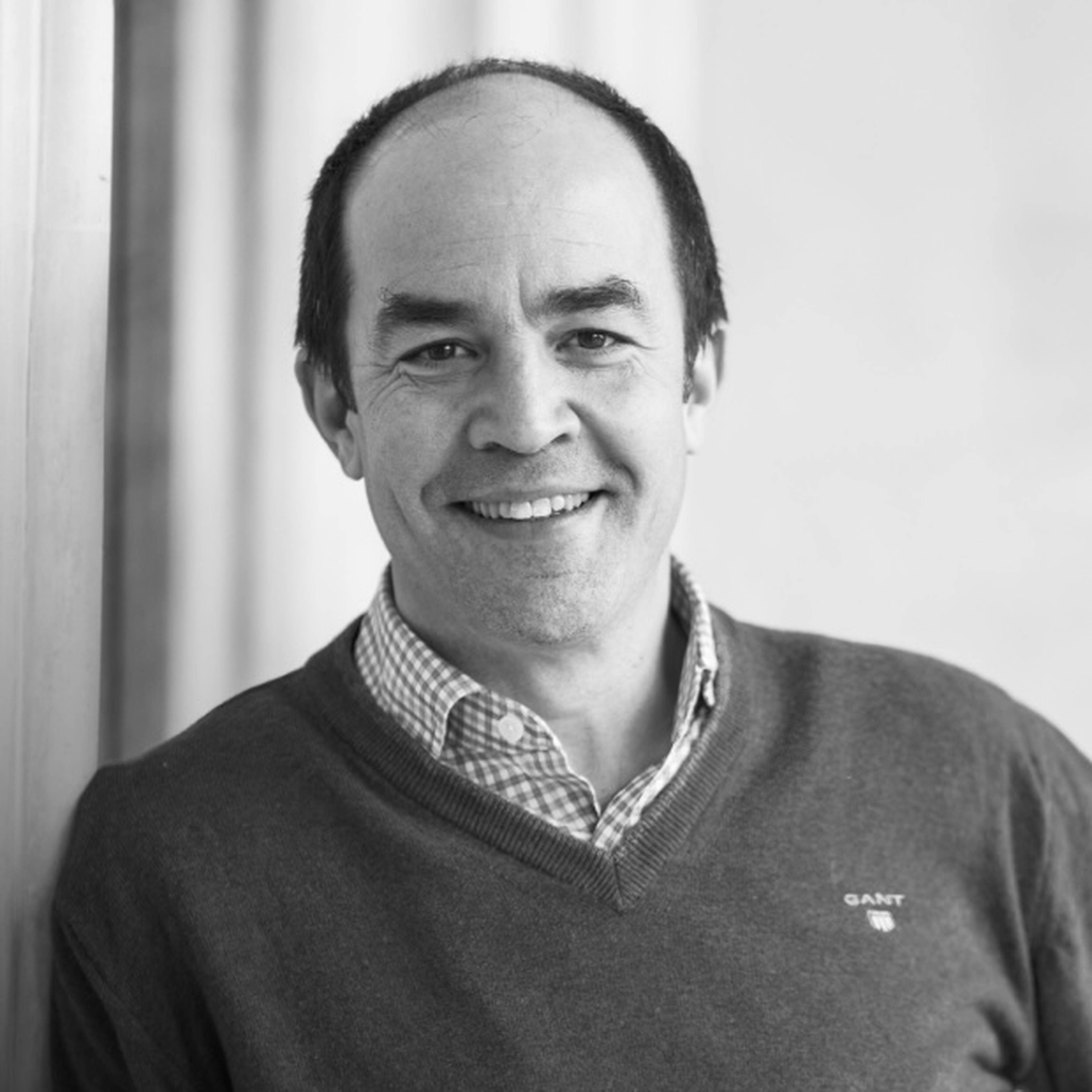 Headshot of Stefan Cousquer in black and white