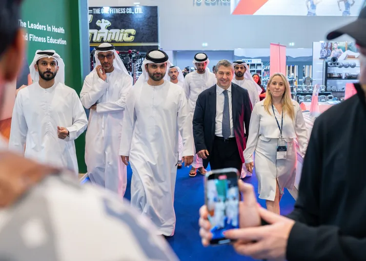 Dignitaries touring the show floor with exhibition staff