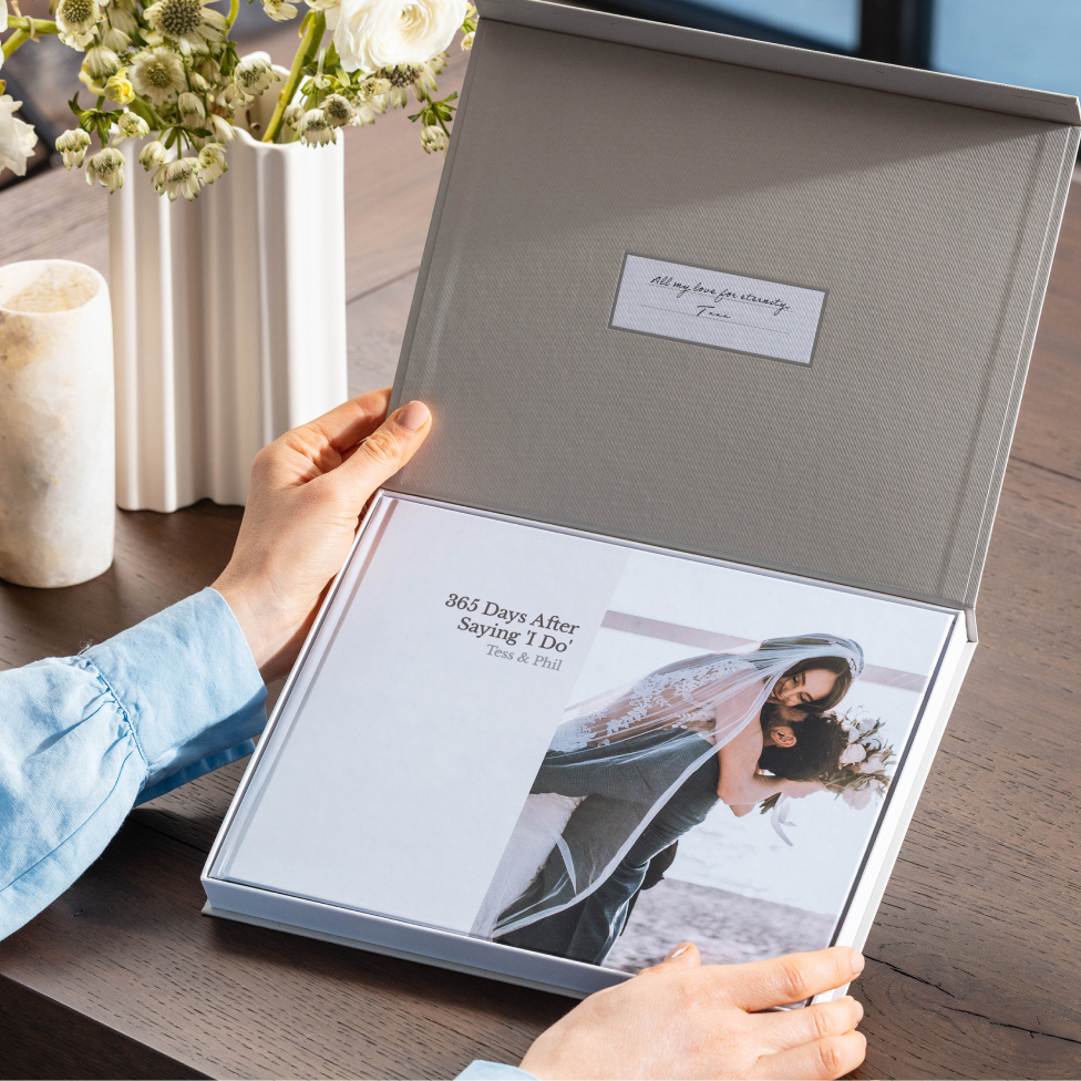 Personalized first anniversary photo book presented in a keepsake box