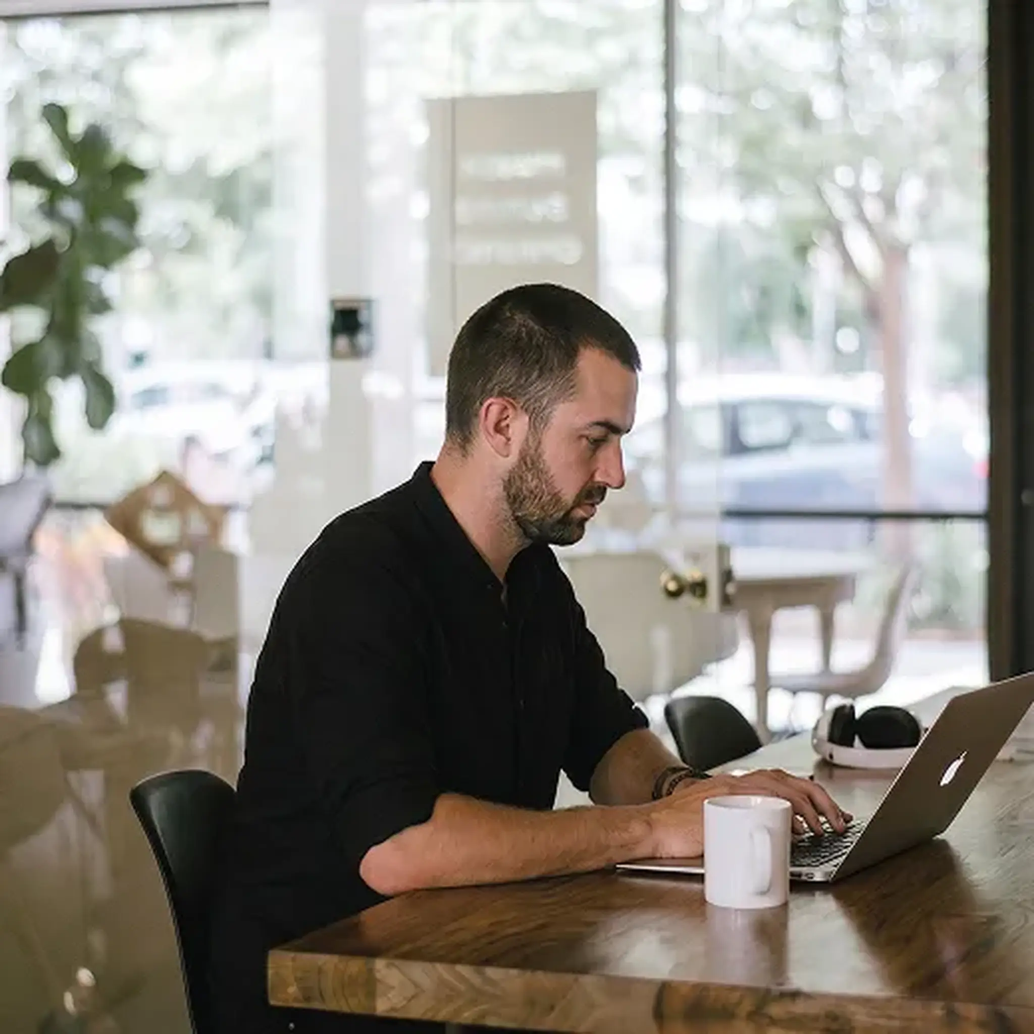 A man working on a laptop at a desk