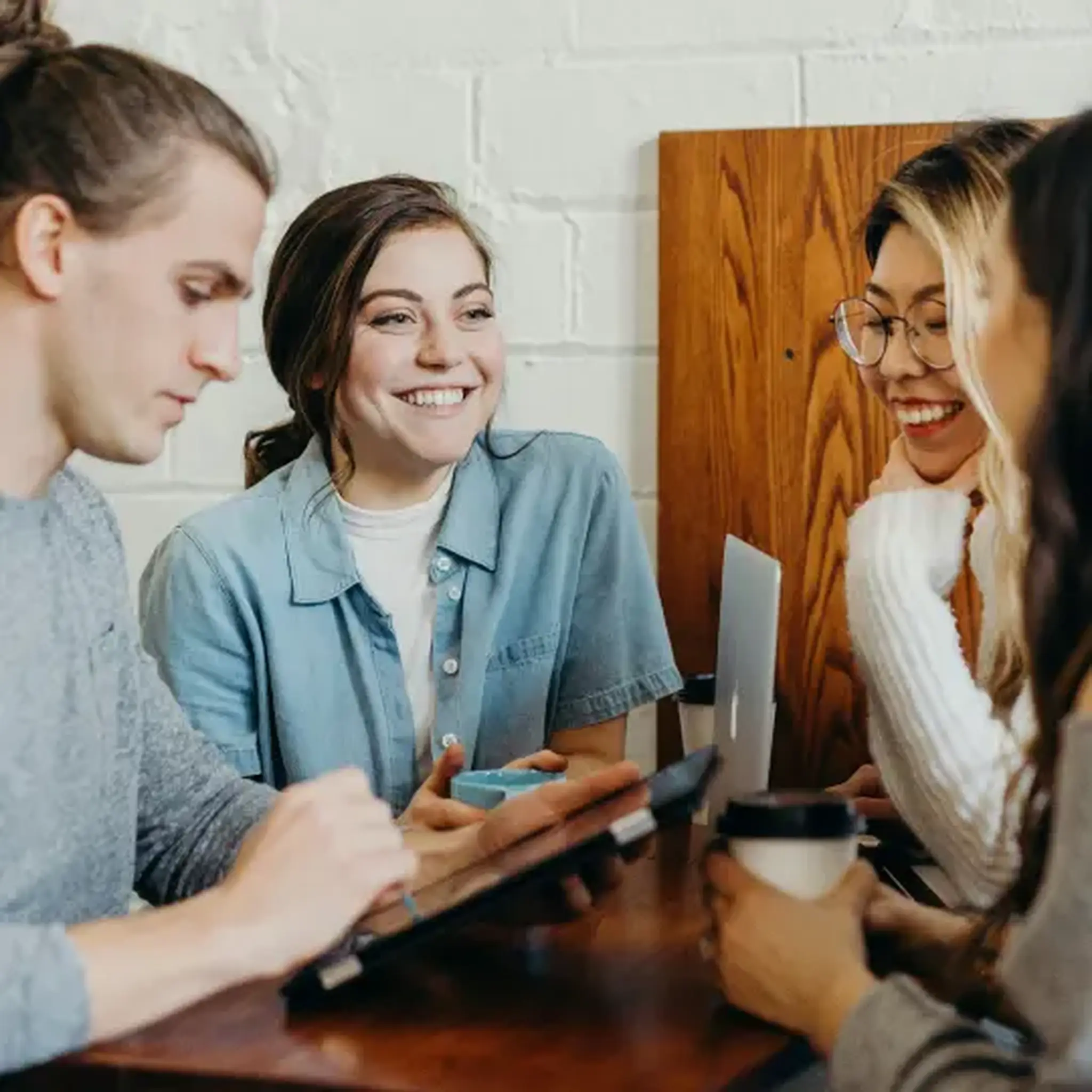 Group of colleagues smiling and working