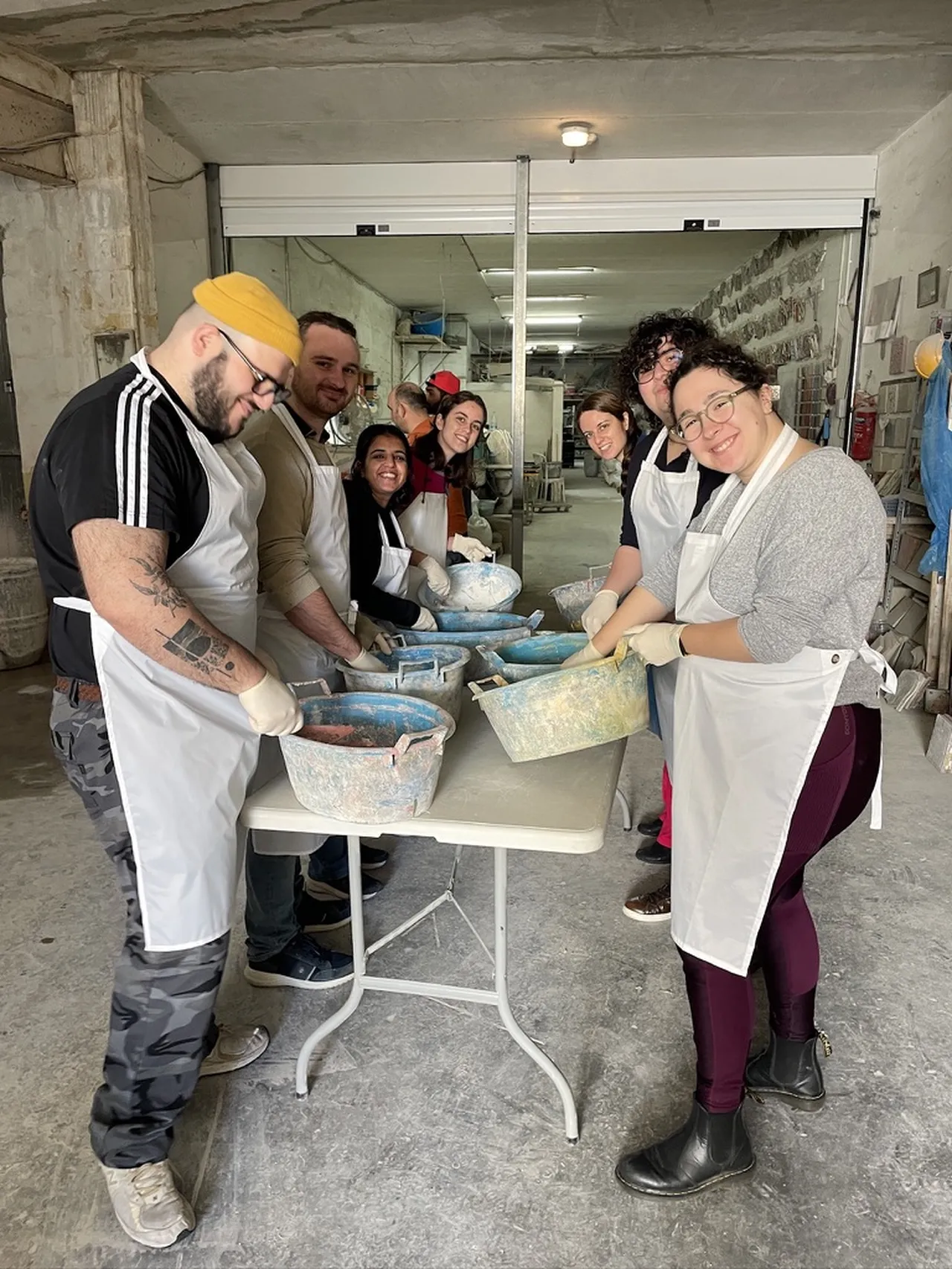 Participants making their own tiles at a Malta Tiles workshop