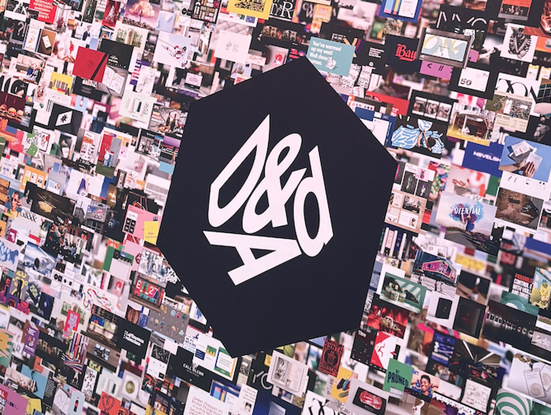 A wall covered with the D&AD logo and multiple overlapping images.