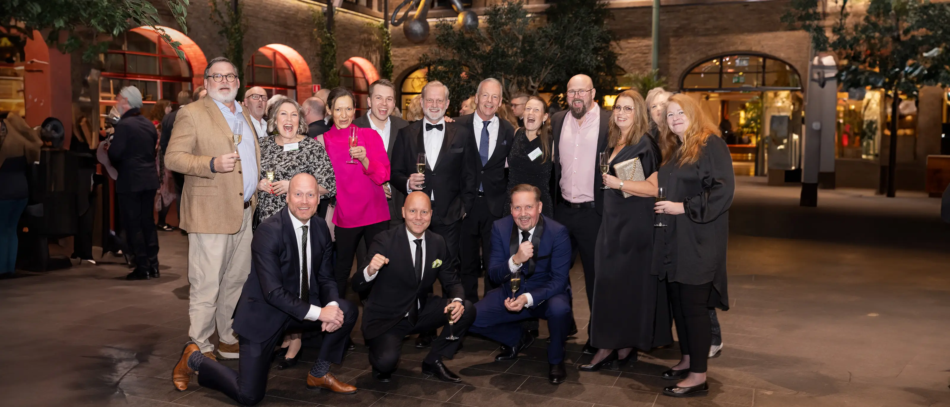 Gruppbild på franchisetagare från konferens