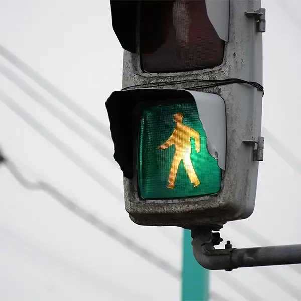 A green light for pedestrians to walk across a road