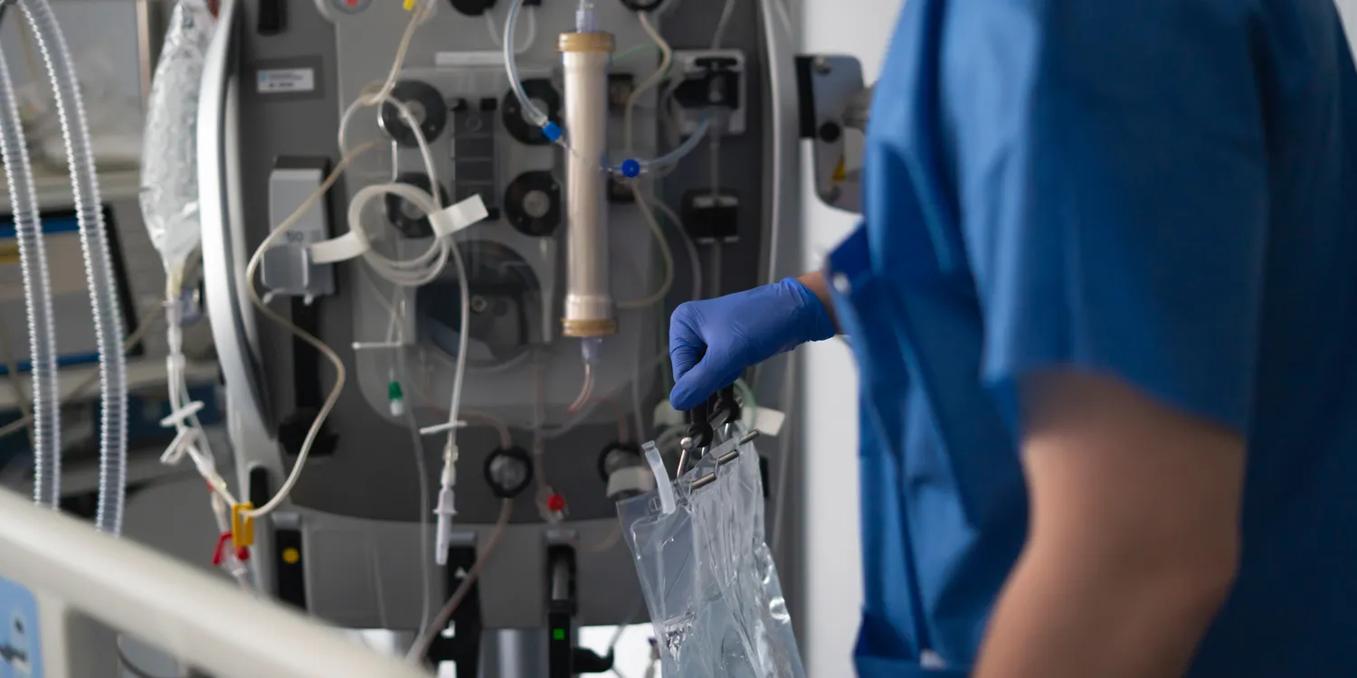 doctor-operating-dialysis-machine-in-hospital-room