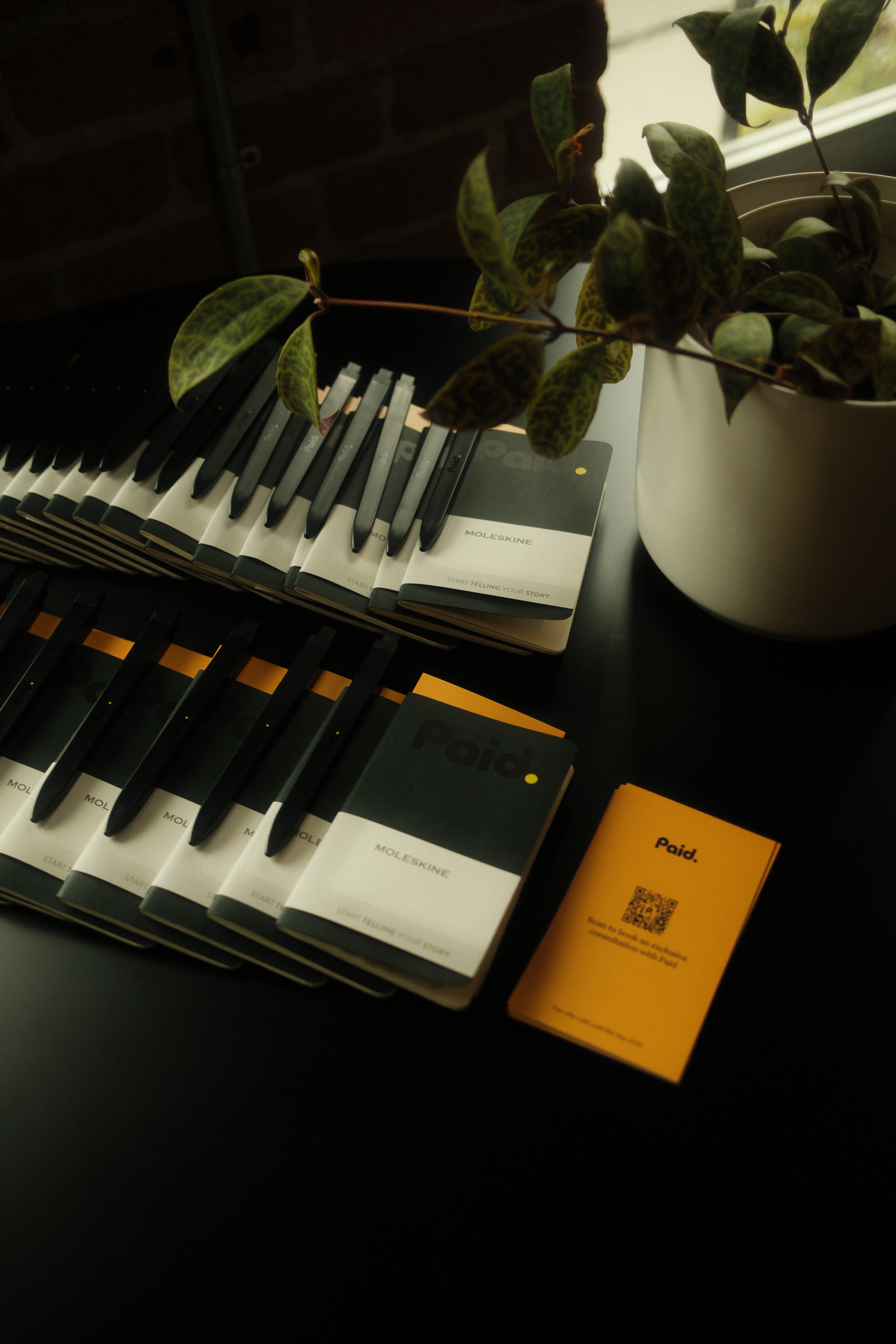 Paid Moleskine notebooks with QR code inserts