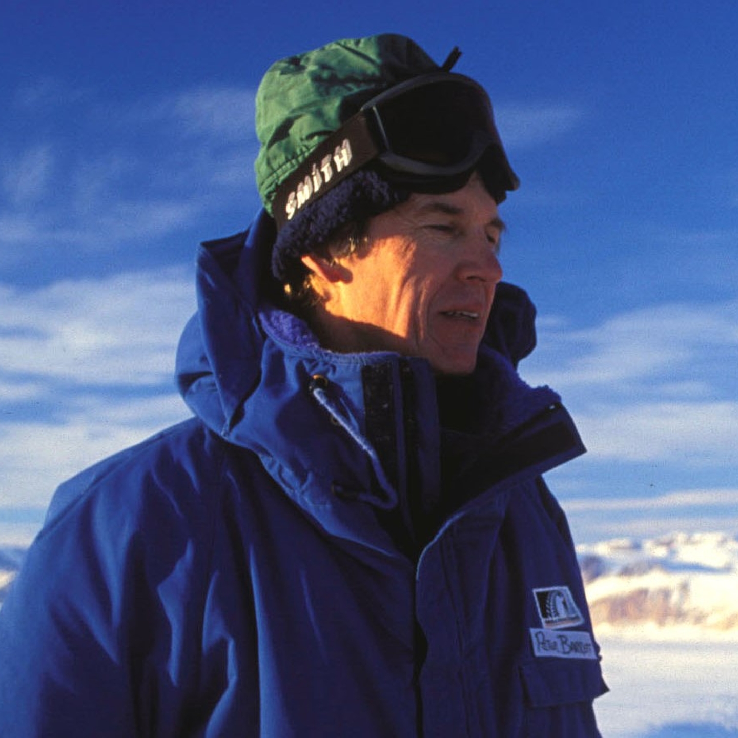 Peter Barrett on the ice with the Transantarctic Mountains in the 1990s Credit: Hannes Grobes. Creative Commons 2.5