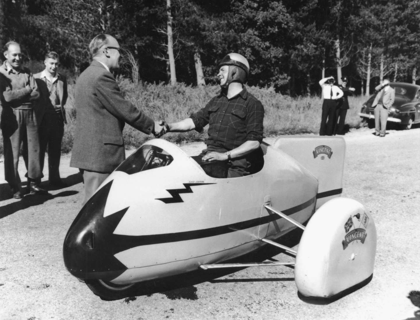 Robert Burns after setting his world speed record for motorbike and sidecar on 2 July 1955. Canterbury Museum 1997.12.1