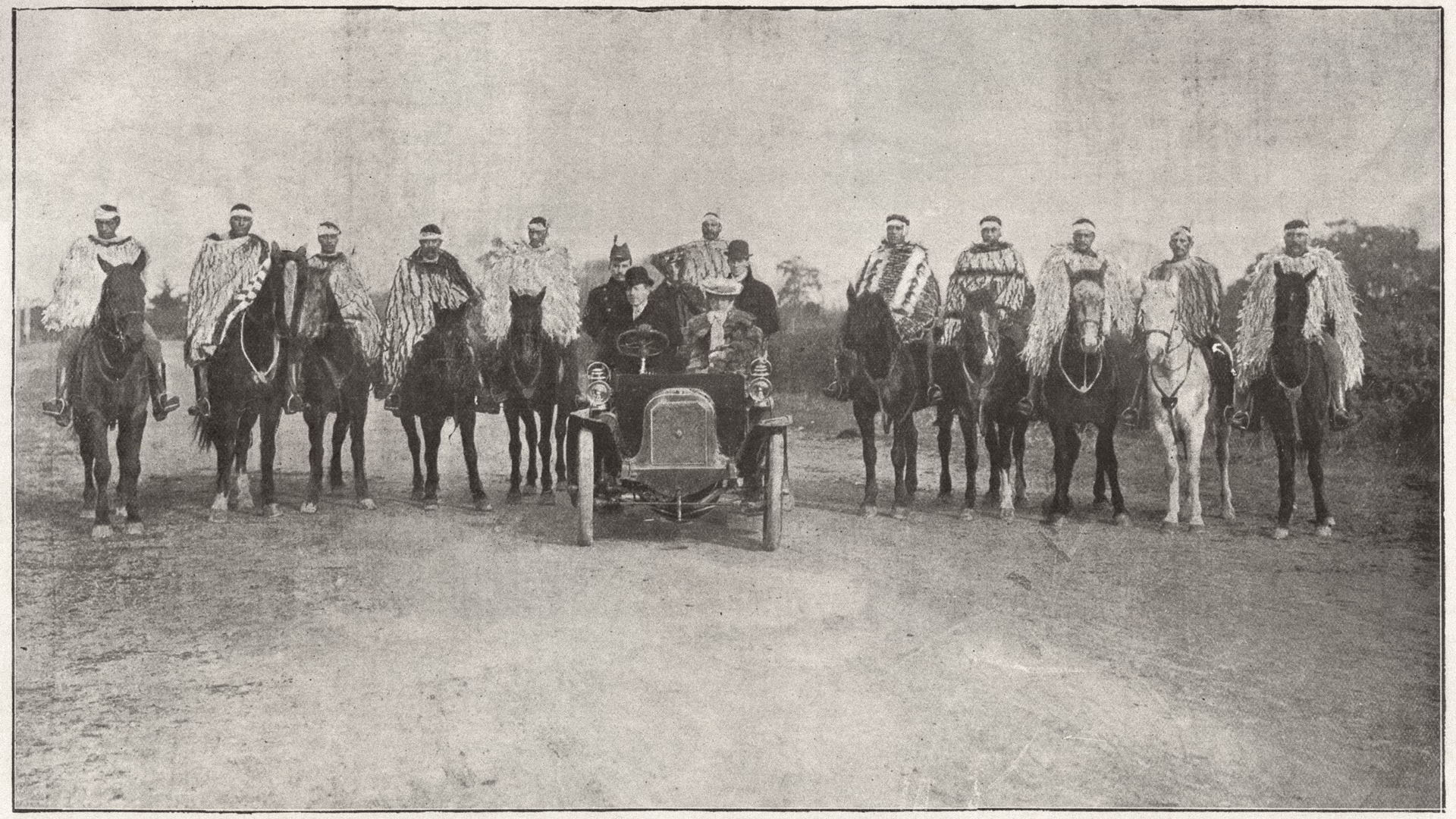 An image from The Weekly Press. On horseback: Eri Tuhuru, left, Korako, Henare Wepu, Henare Rupene, J Kingi, Captain Uru, Perewiti, Erure te Aik, Teoti Pitama, Tiki Ritara, Wakapere. In the car: Front row: Lord and Lady Plunket. Back row: Captain Braithwaite, Kathleen Plunket, H C Waterfield. Bishop Collection. Canterbury Museum 1923.53.754