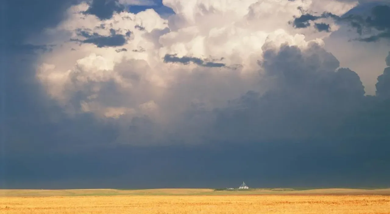 A thunderstorm over a field in CO