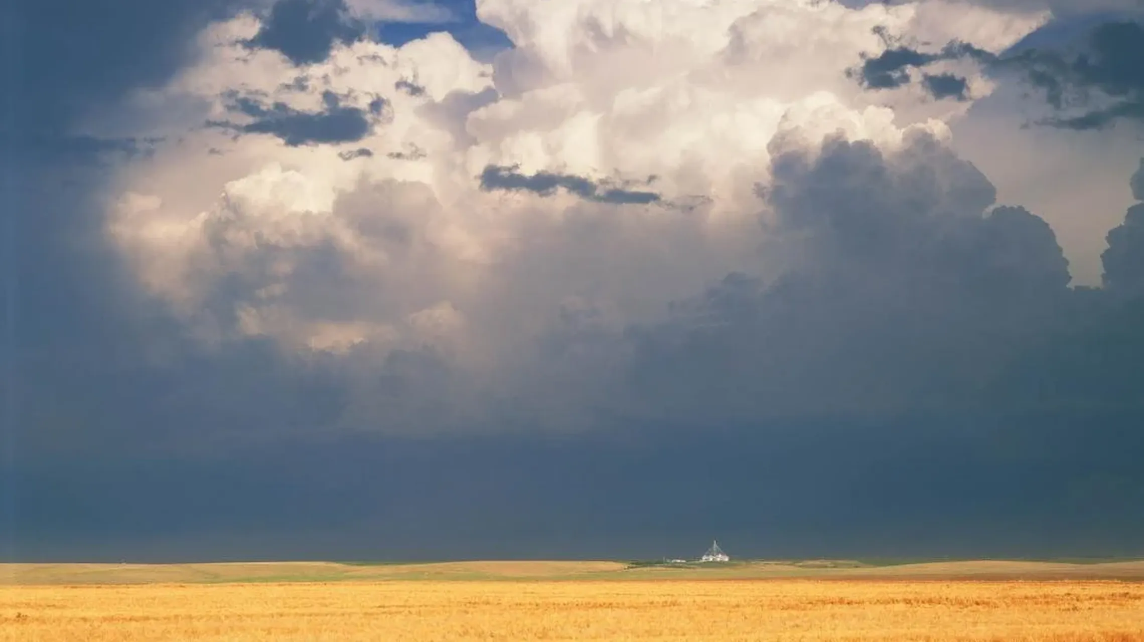 A thunderstorm over a field in CO