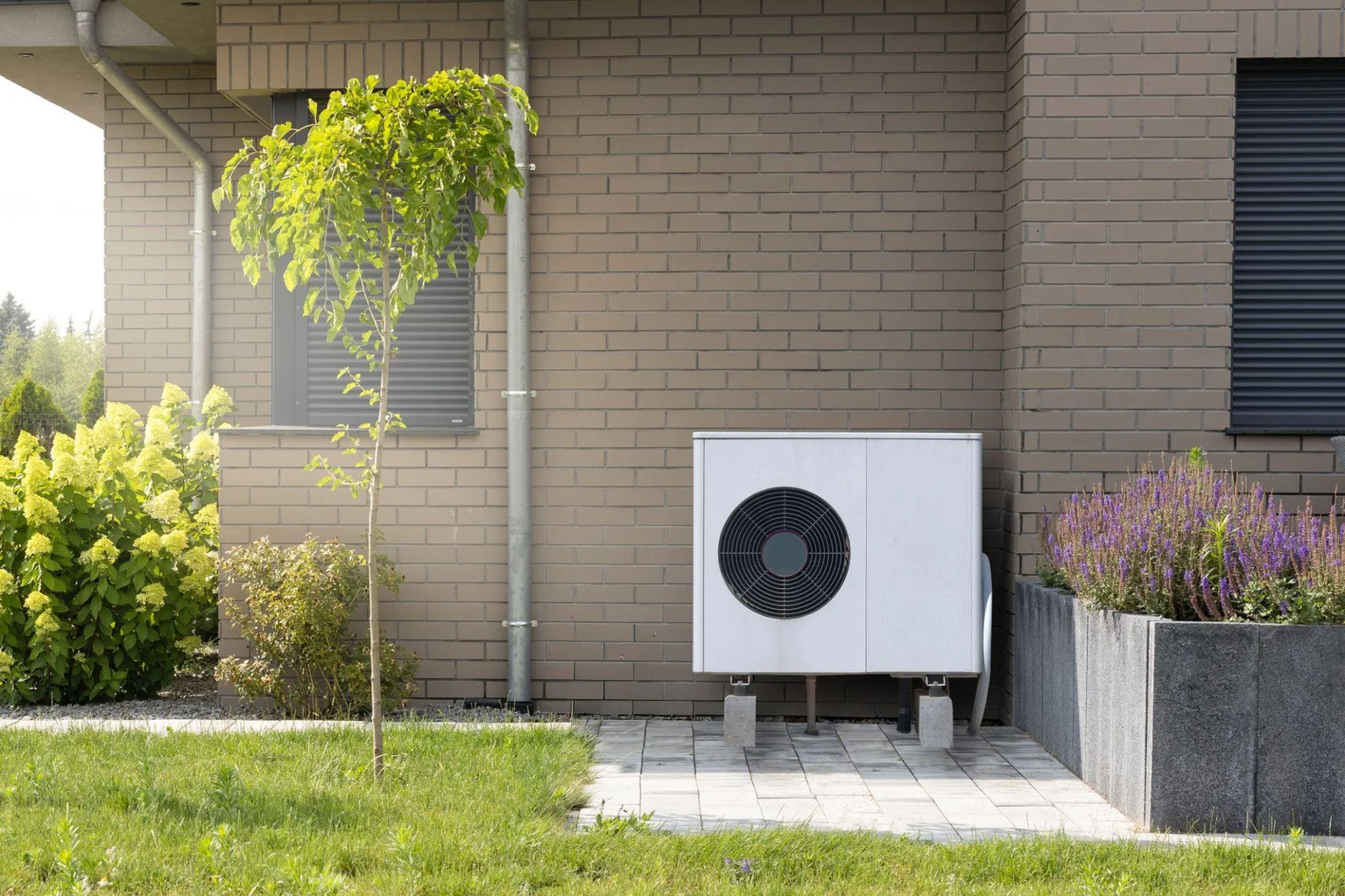 Outdoor heat pump unit operating in snow (photo coming soon)