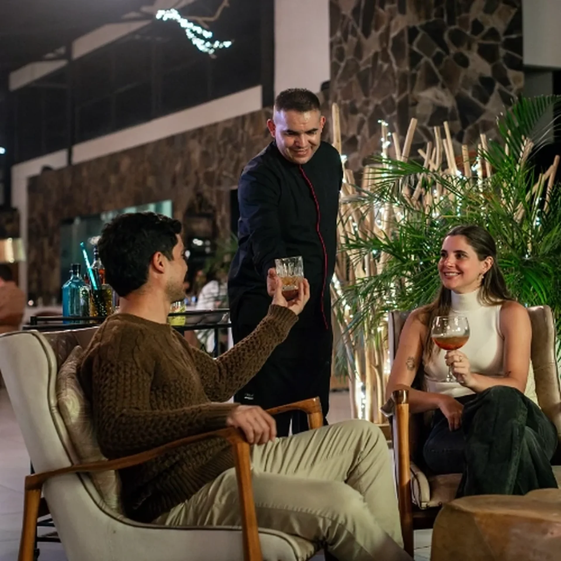 Waiter serving guests at Sierra Lago