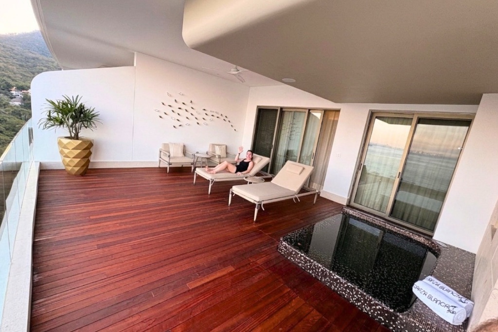 woman resting in a pool chair in a terrace