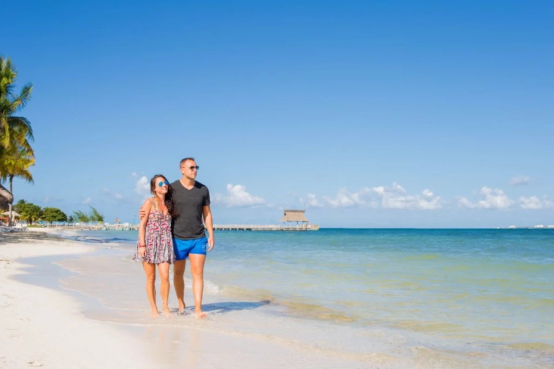 couples walking on a beach