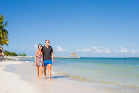 couples walking on a beach