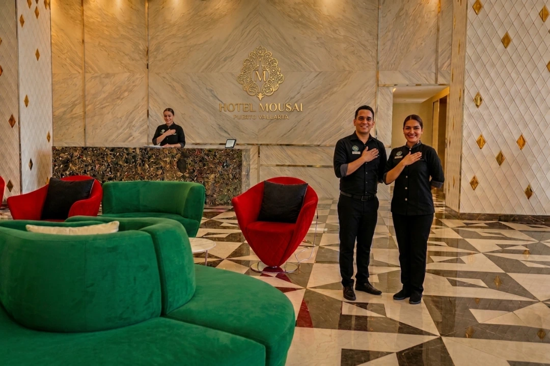 mousai staff recieving guest with the greeting to the heart