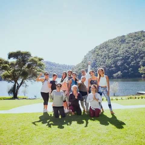 Group of friends celebrating on the lawn by Juanacatlán Lake at Sierra Lago