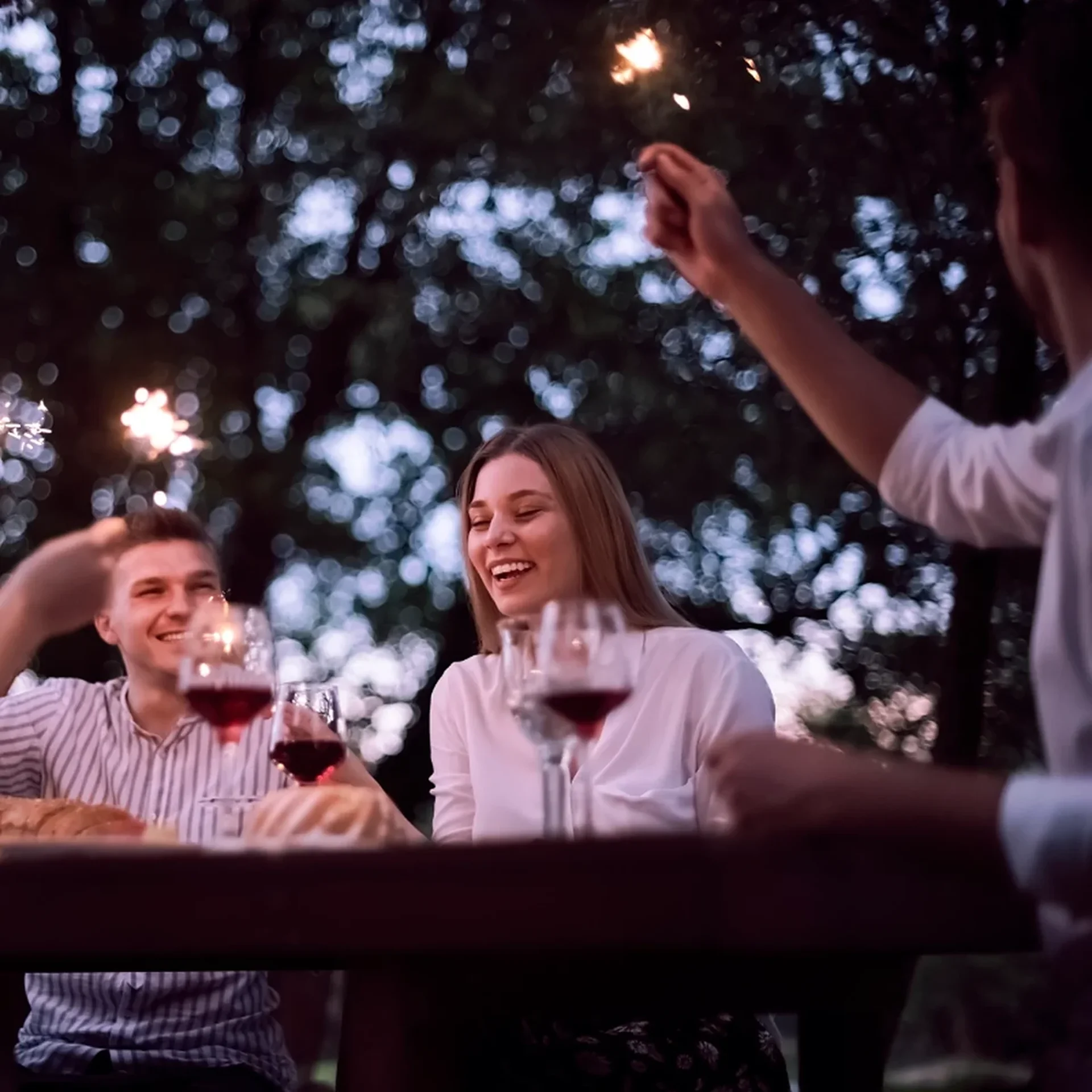 Friends toasting at a celebration dinner at Sierra Lago