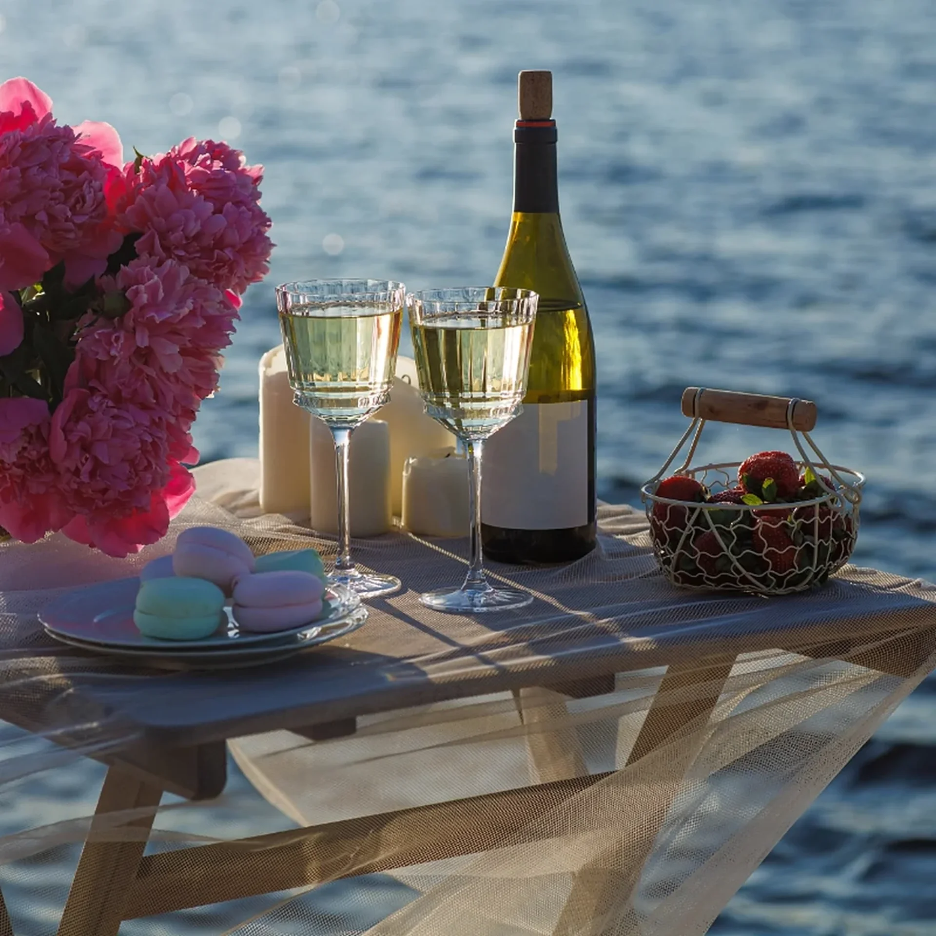 Wine and dessert table by the lake at Sierra Lago