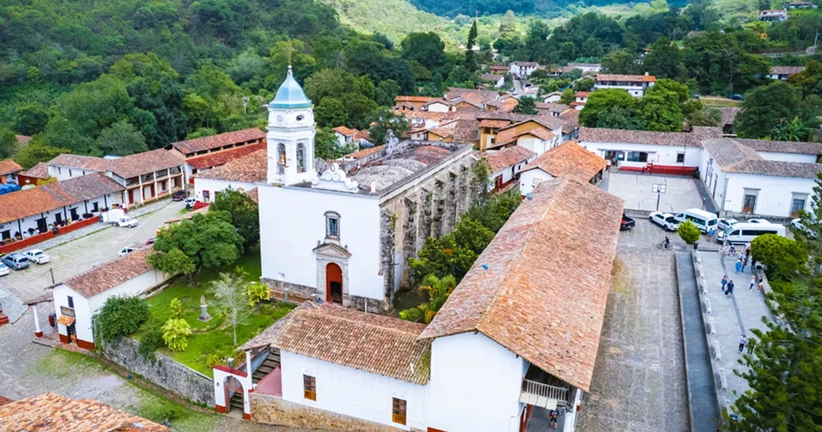 Aerial view of the church and red-roofed houses of San Sebastián del Oeste
