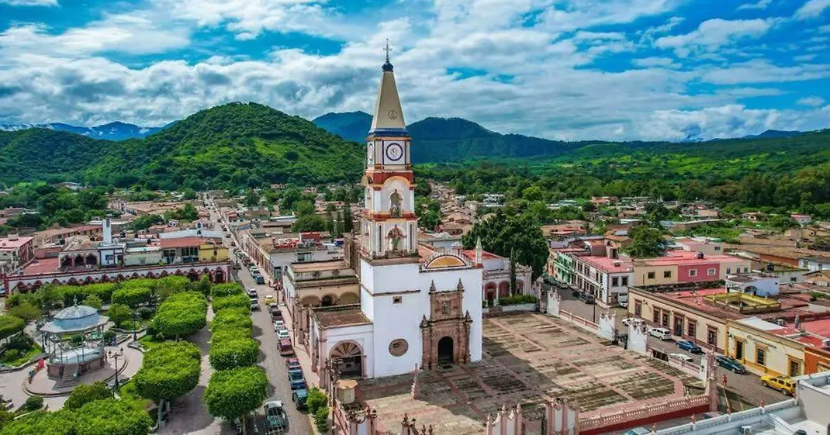 Aerial view of downtown Mascota with its clock tower, plaza and mountains