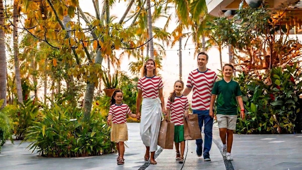 Family at garza blanca walking with soccer jerseys